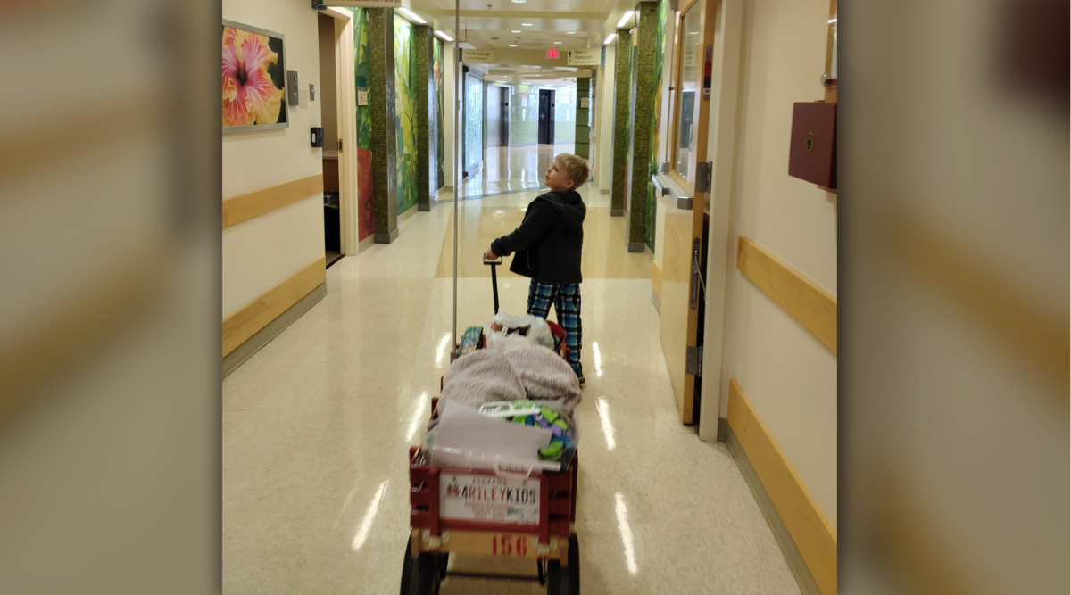 boy with Riley wagon