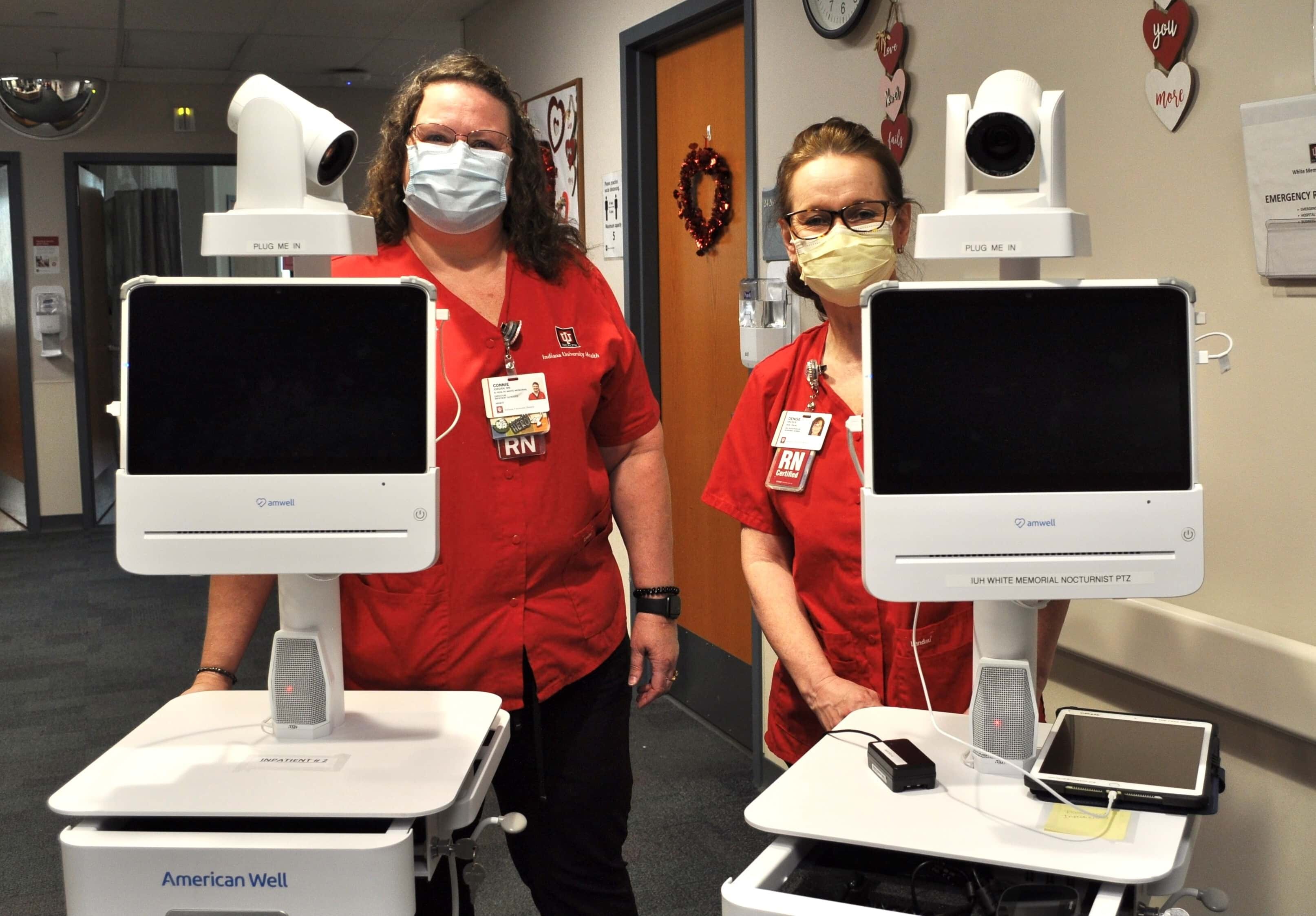 Telehealth healthcare workers showcasing new telecommunications technologies