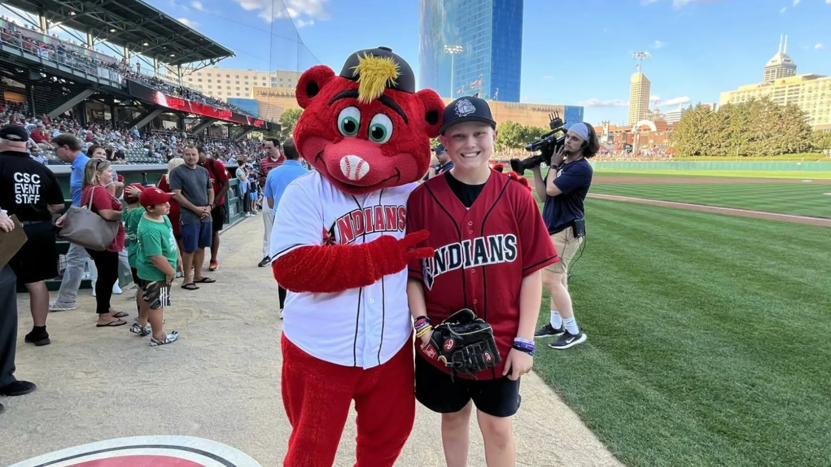 Patient battling cancer throws out first pitch at Indians game