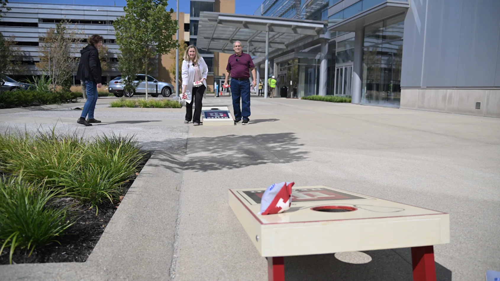 Grateful patient gifts custom cornhole set to his surgeons