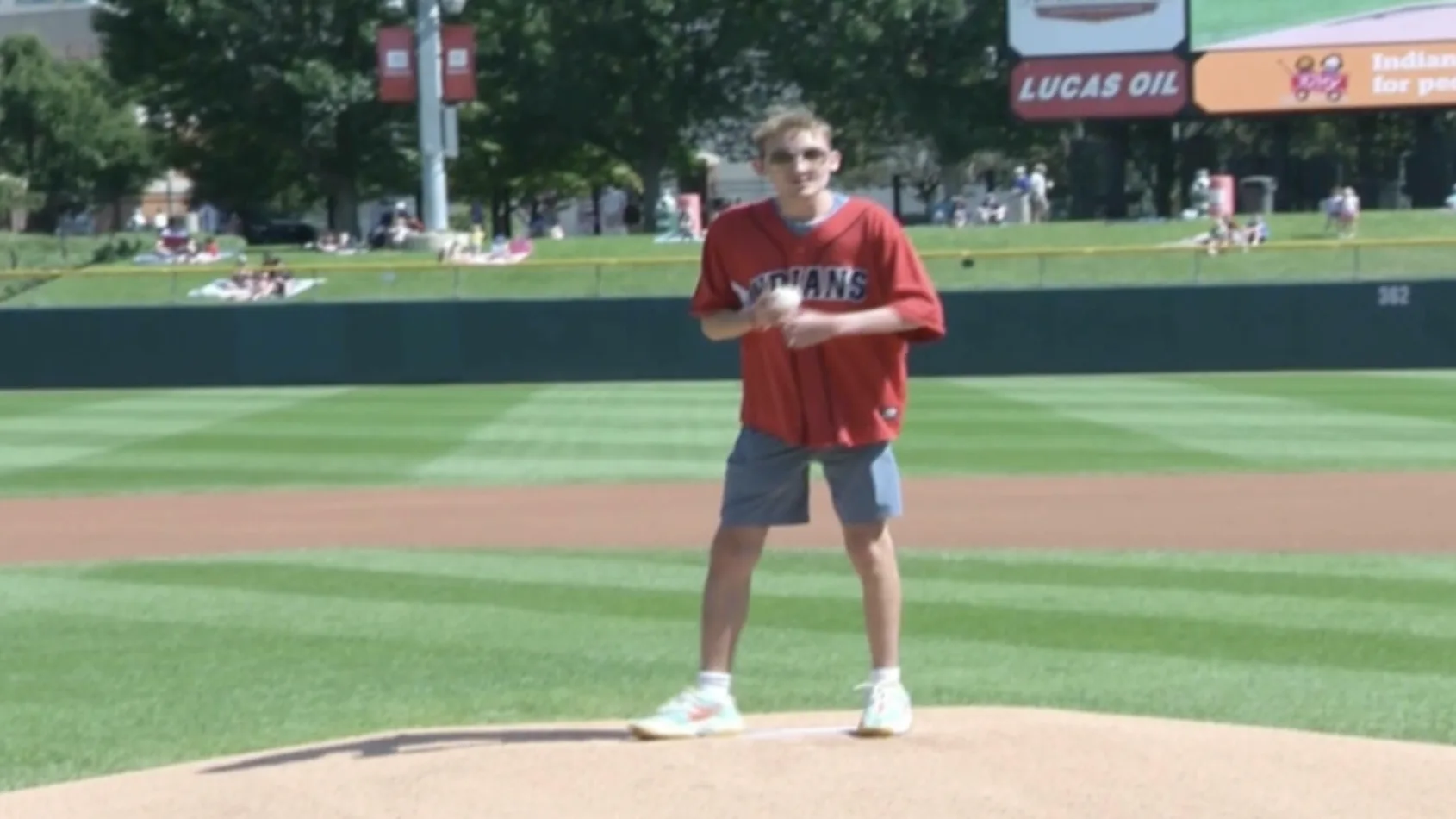 Riley kid, Matthias Pfister throws first pitch at Indians game