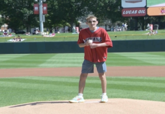 Riley kid, Matthias Pfister throws first pitch at Indians game