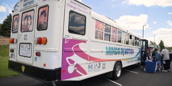 IU Health proud to support Minds in Motion bus focused on mental health image.