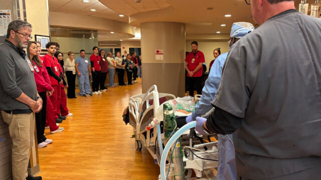 Team member pause, show respect for patient image.