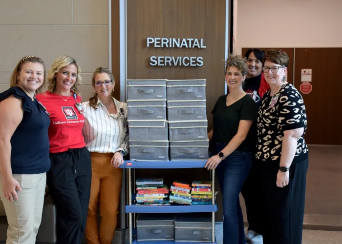 Melissa Nam donating books and memory boxes to IU Health Bloomington Perinatal Services.