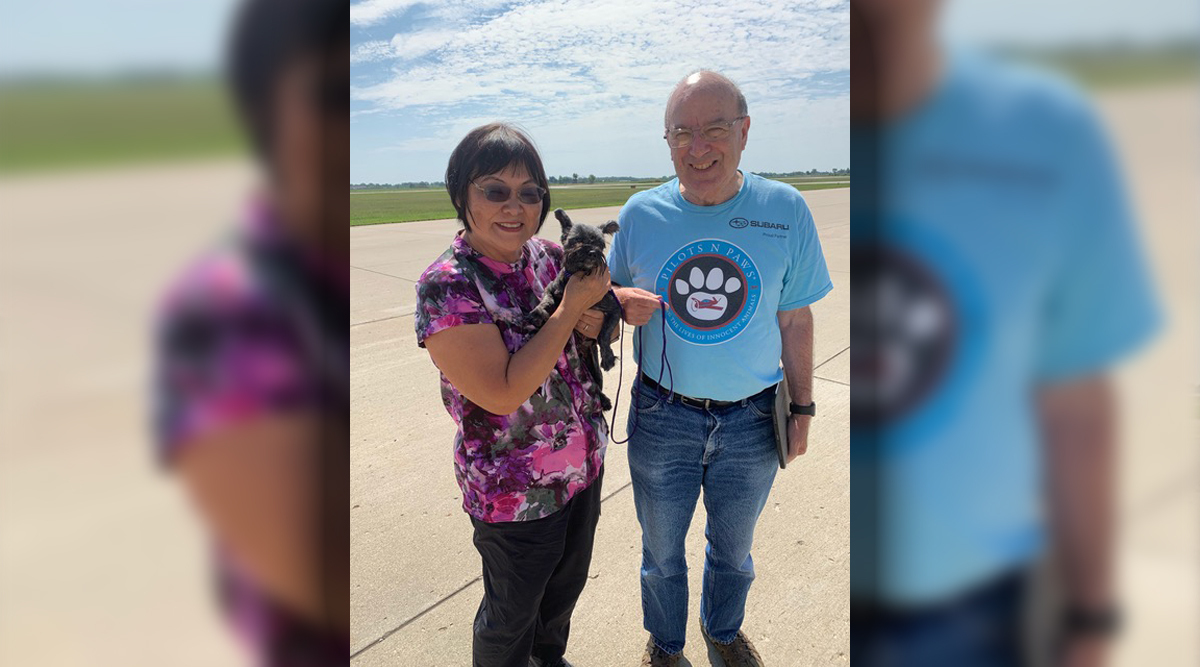 Ami and Mariash holding a dog