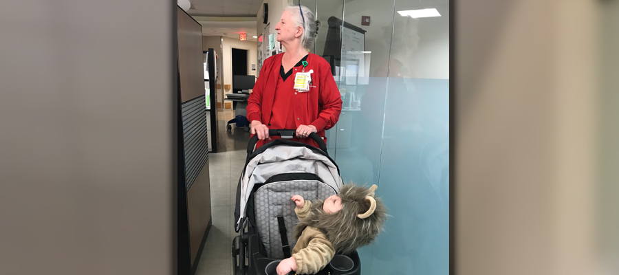 Harris pushing a stroller